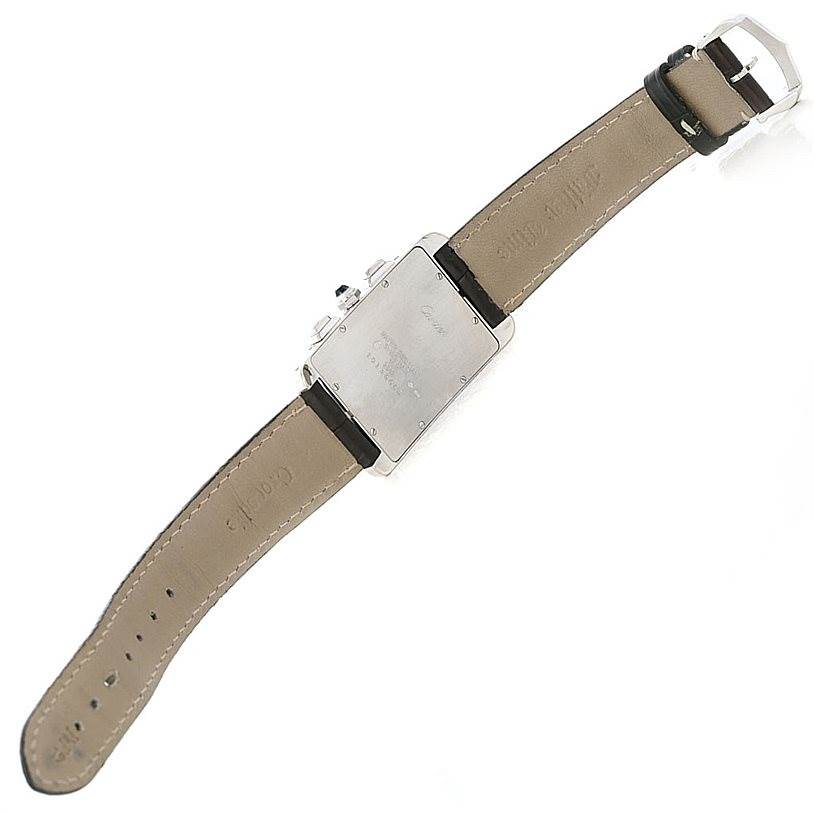 The image shows the back view of a Cartier Tank Americaine W2603358 Men's White Gold Silver Dial W2603358 Men's White Gold Silver Dial watch, displaying the case back and leather strap.