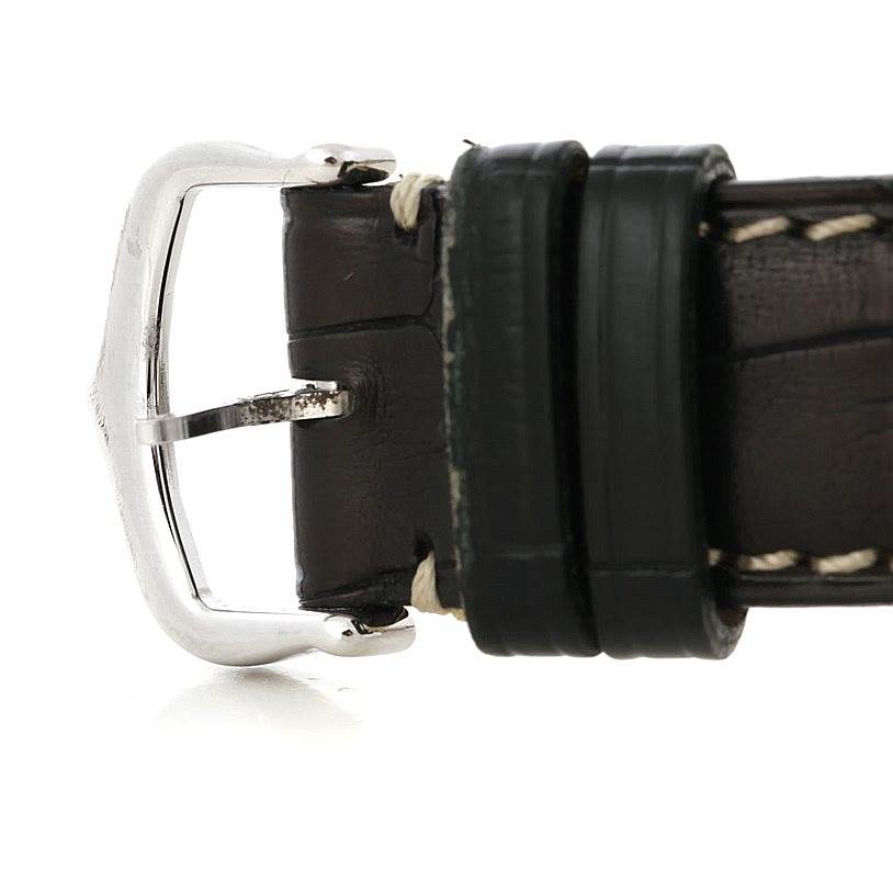 This image shows a side view of the strap buckle and leather band of a Cartier Tank Américaine watch.