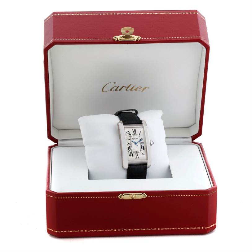 The Cartier Tank Americaine W2603256 Men's White Gold Silver Dial W2603256 Men's White Gold Silver Dial watch is shown front-on, displayed in a red Cartier box with a cushioned interior.