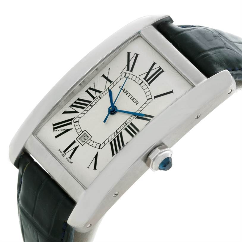 This image shows a side angle of the Cartier Tank Americaine W2603256 Men's White Gold Silver Dial W2603256 Men's White Gold Silver Dial watch, highlighting the rectangular face, blue hands, and leather strap.