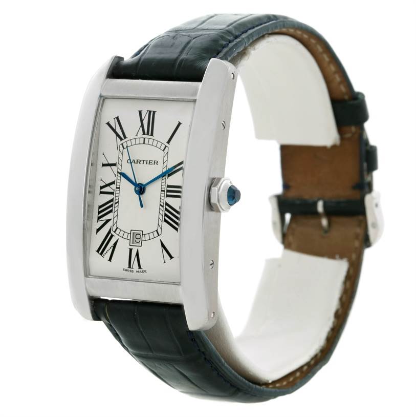 The image shows a Cartier Tank Americaine W2603256 Men's White Gold Silver Dial W2603256 Men's White Gold Silver Dial watch in a three-quarter view, highlighting the face, bezel, and leather strap.