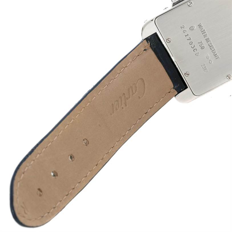 The image shows the case back and leather strap of a Cartier Tank Américaine watch.