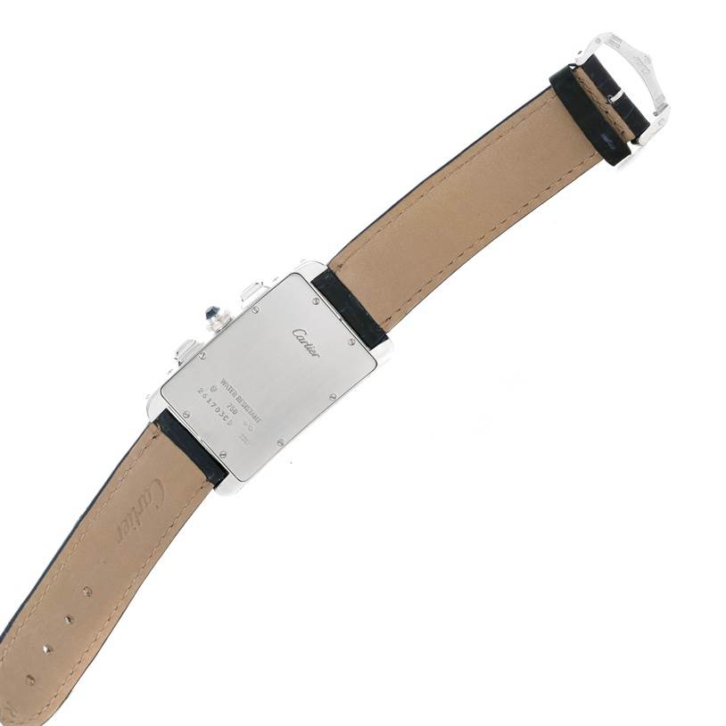 The image shows the back of a Cartier Tank Americaine W2603358 White Gold Silver Dial W2603358 White Gold Silver Dial watch, displaying its leather strap and metal case back.