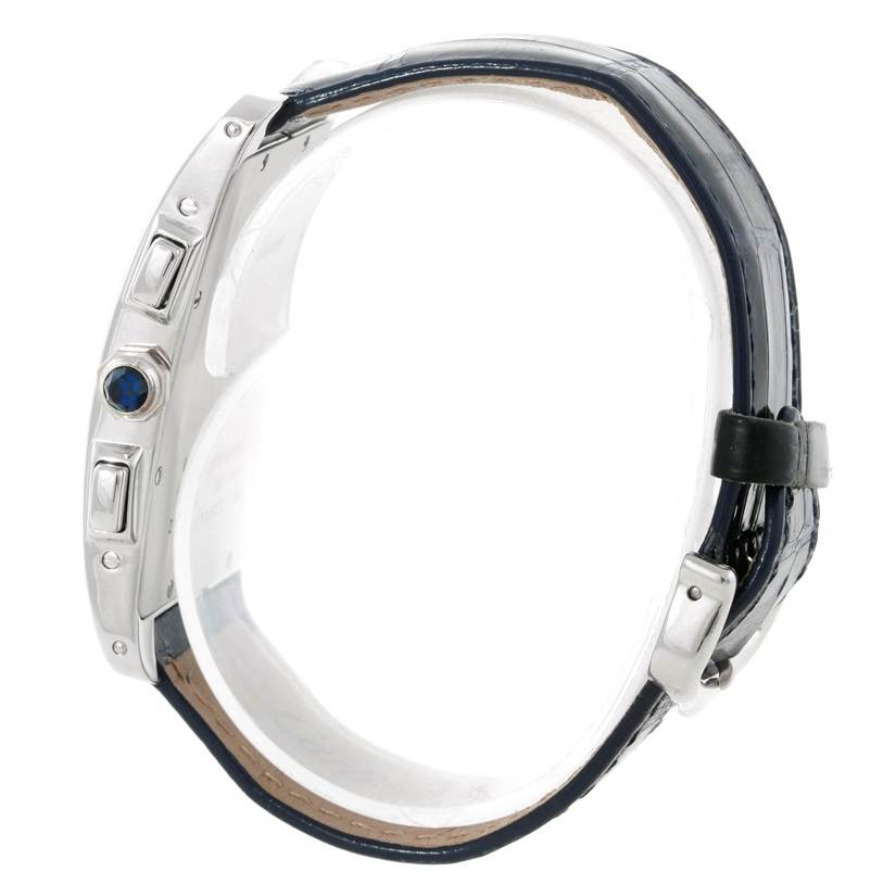 The image shows a side view of the Cartier Tank Americaine W2603358 White Gold Silver Dial W2603358 White Gold Silver Dial watch, highlighting the case, crown, and parts of the strap.