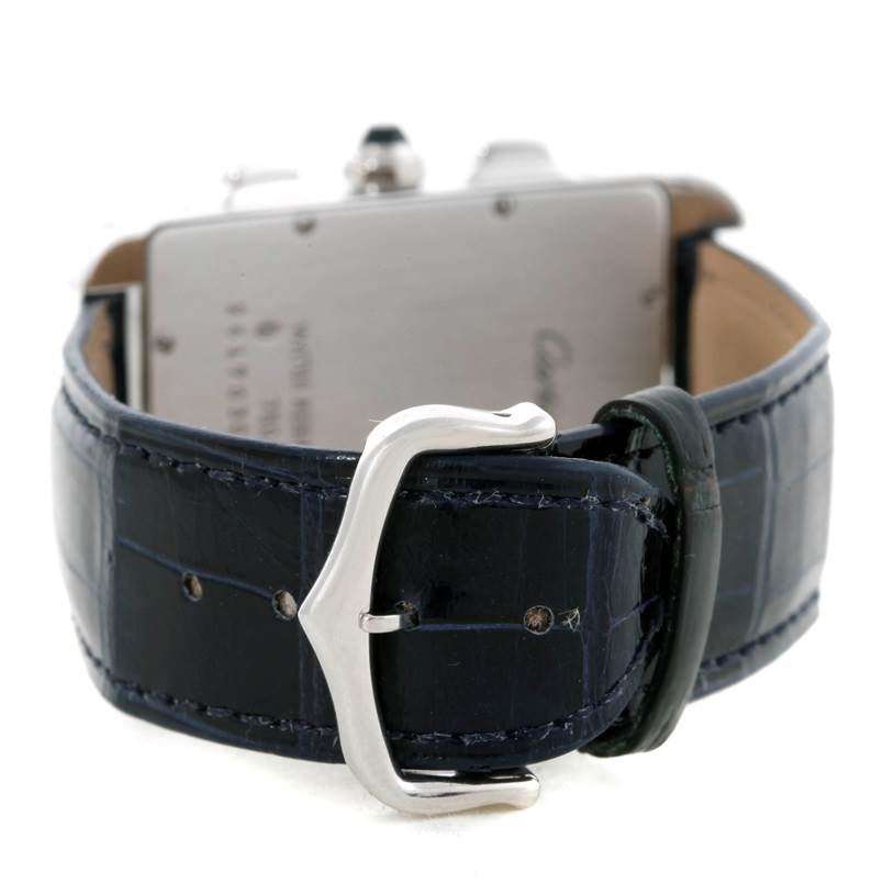 The image shows the back view of a Cartier Tank Americaine W2603358 White Gold Silver Dial W2603358 White Gold Silver Dial watch, focusing on its black leather strap and silver buckle.