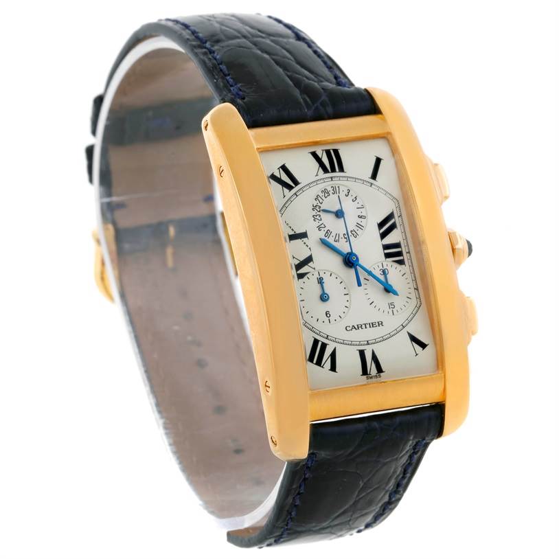 This image shows a Cartier Tank Americaine W2601156 Men
s Yellow Gold Silver Dial W2601156 Men
s Yellow Gold Silver Dial watch at a slight angle, highlighting its rectangular face, blue leather strap, and side buttons.