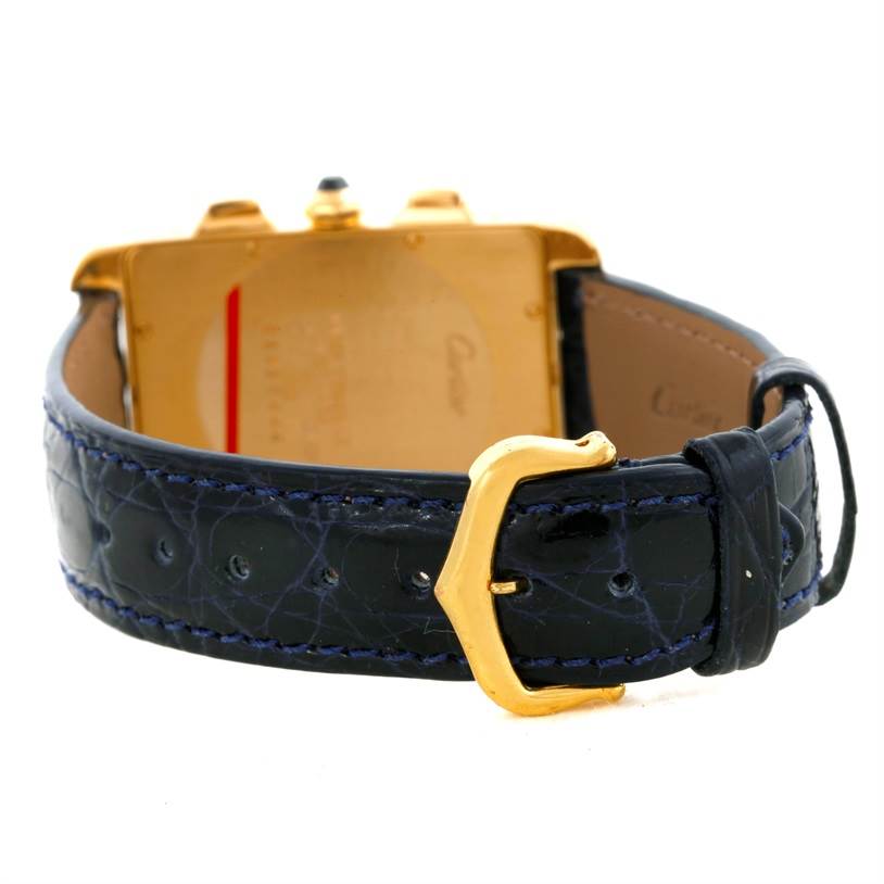 The image shows the back of a Cartier Tank Americaine W2601156 Men
s Yellow Gold Silver Dial W2601156 Men
s Yellow Gold Silver Dial watch, focusing on the leather strap and gold buckle.