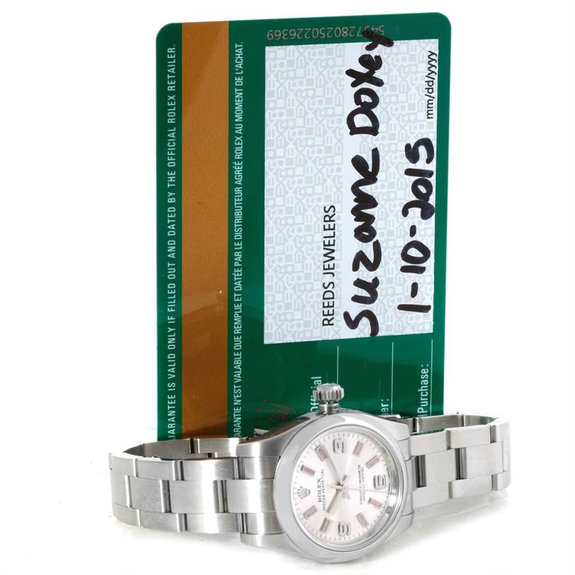 The photo shows a Rolex Oyster Perpetual 176200 Women's Stainless Steel Silver Dial 176200 Women's Stainless Steel Silver Dial watch placed horizontally in front of a Rolex warranty card.