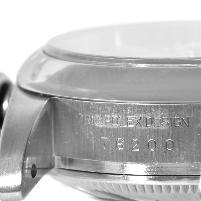 This image shows a close-up side view of the case of a Rolex Oyster Perpetual 176200 Women's Stainless Steel Silver Dial 176200 Women's Stainless Steel Silver Dial watch, prominently displaying the model number and "ORIG. ROLEX DESIGN" engraving.