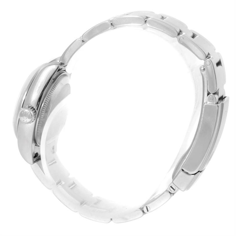 The image shows a side view of the Rolex Oyster Perpetual 176200 Women's Stainless Steel Silver Dial 176200 Women's Stainless Steel Silver Dial watch, displaying its metal bracelet and crown.