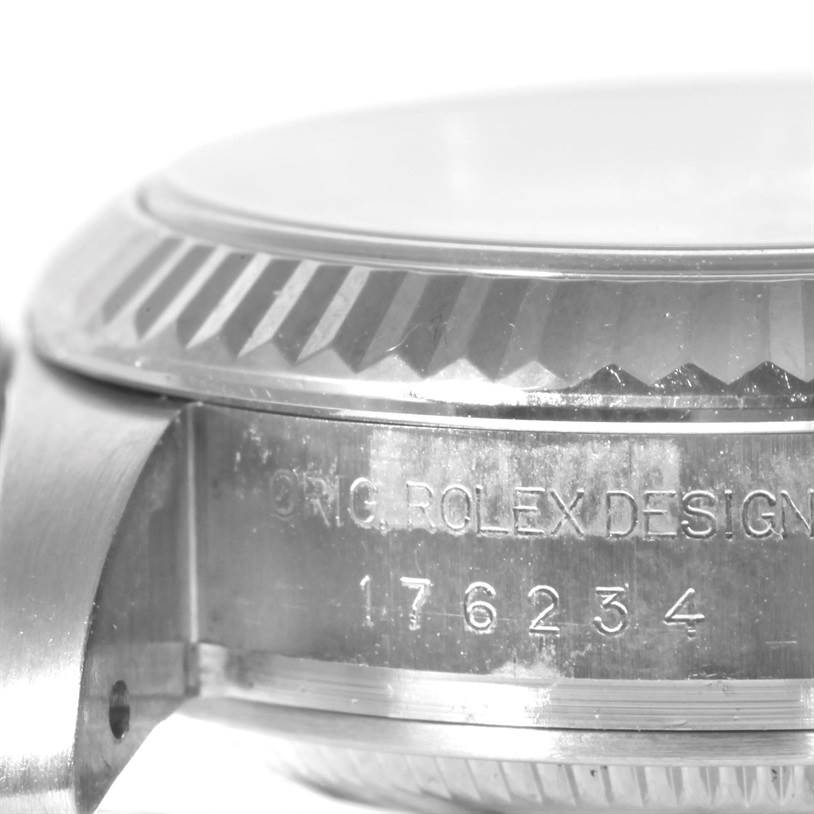 This image shows a close-up of the side case and fluted bezel of a Rolex Oyster Perpetual 176234 Women's Stainless Steel White Dial 176234 Women's Stainless Steel White Dial, highlighting the "ORIG. ROLEX DESIGN" and serial number engraving.