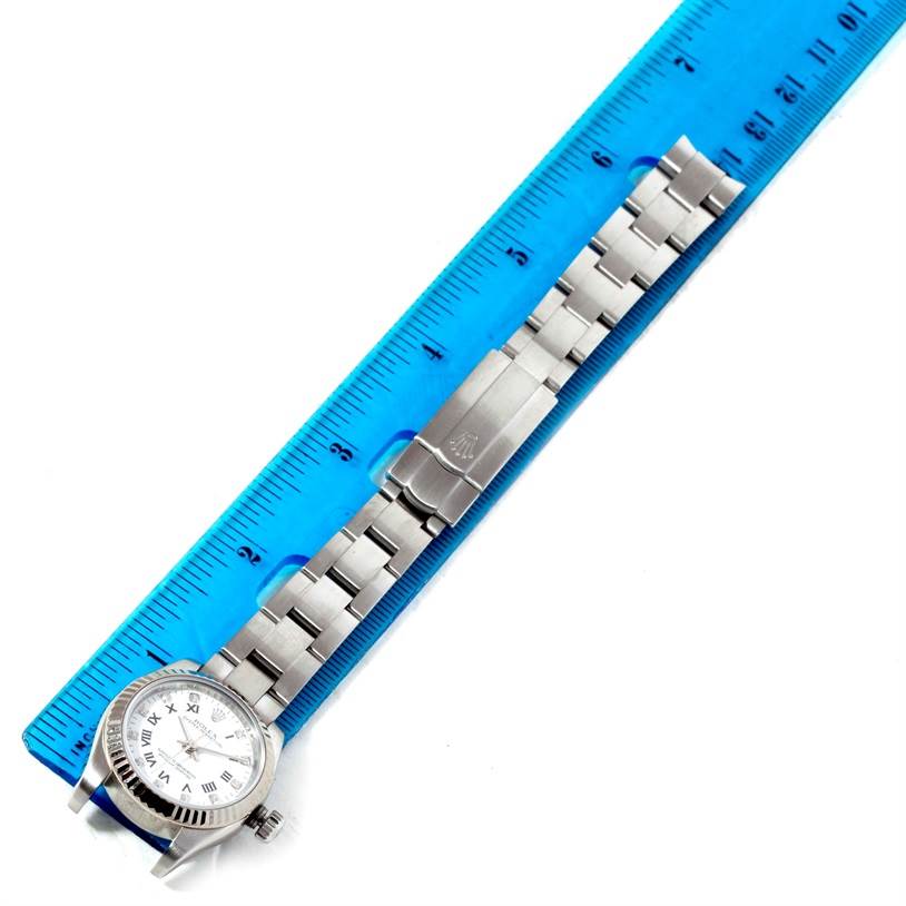 The image shows a side view of a Rolex Oyster Perpetual 176234 Women's Stainless Steel White Dial 176234 Women's Stainless Steel White Dial watch with its metal bracelet aligned with a ruler.