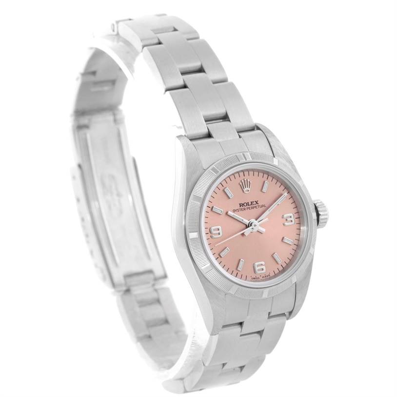 The image shows a Rolex Oyster Perpetual 76030 Women's Stainless Steel Pink Dial 76030 Women's Stainless Steel Pink Dial watch from an angled top view, highlighting its bracelet, case, dial, and clasp.
