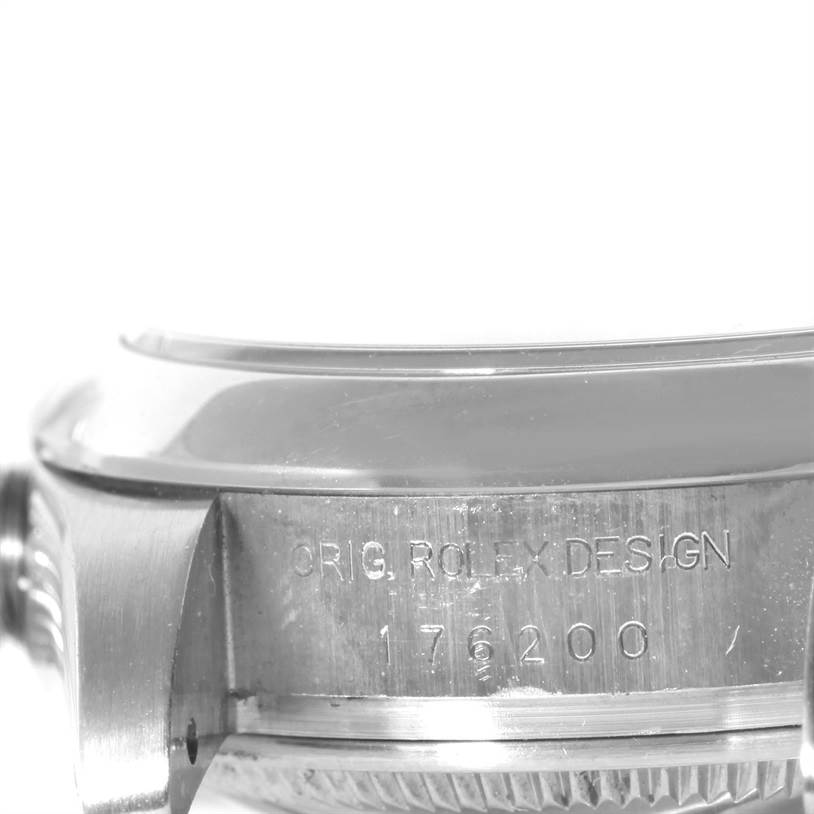 This image shows a close-up of the side of a Rolex Oyster Perpetual 176200 Women's Stainless Steel Black Dial 176200 Women's Stainless Steel Black Dial watch, highlighting the case edge and engraving.