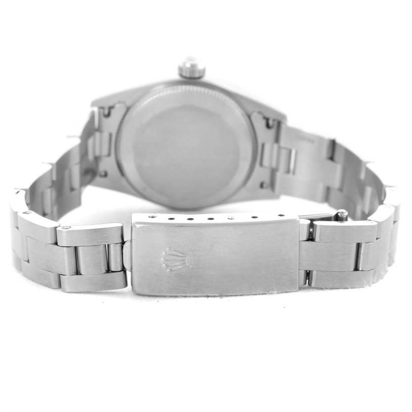 The image shows the back and clasp of a Rolex Oyster Perpetual 76080 Women's Stainless Steel Pink Dial 76080 Women's Stainless Steel Pink Dial watch from a rear angle.