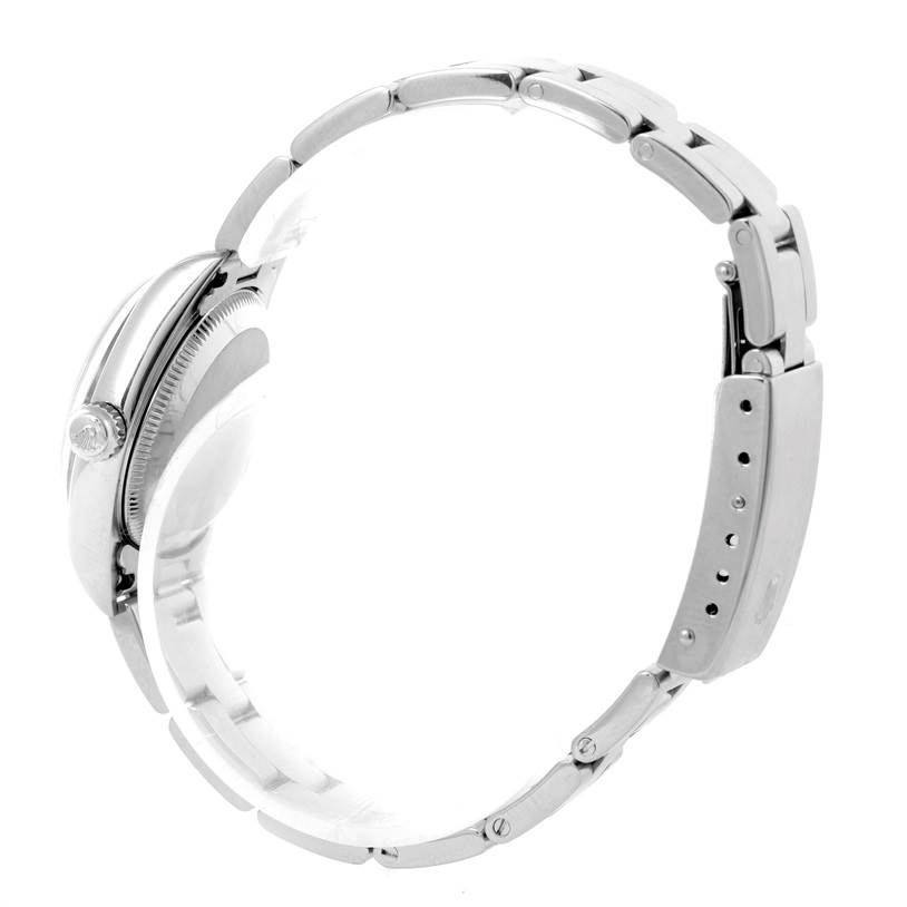 This image shows a side view of the Rolex Oyster Perpetual 76080 Women's Stainless Steel Pink Dial 76080 Women's Stainless Steel Pink Dial watch, highlighting its bracelet and crown.