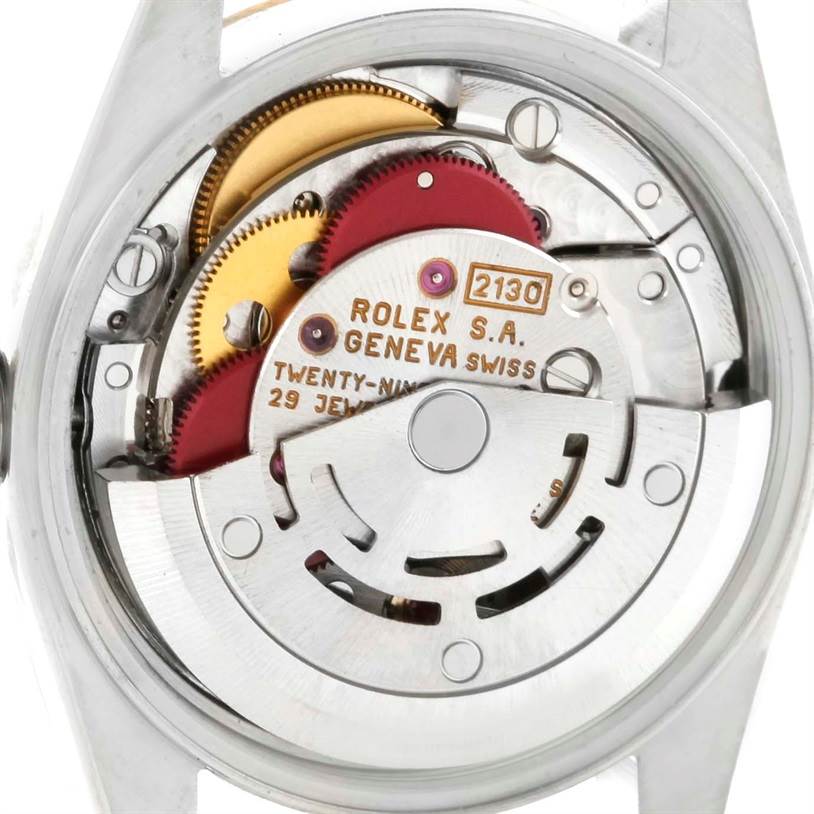 This image shows the back view of the Rolex Oyster Perpetual 67183 Women's Steel and Gold (two tone) Grey Dial 67183 Women's Steel and Gold (two tone) Grey Dial model, highlighting its intricate internal mechanism.