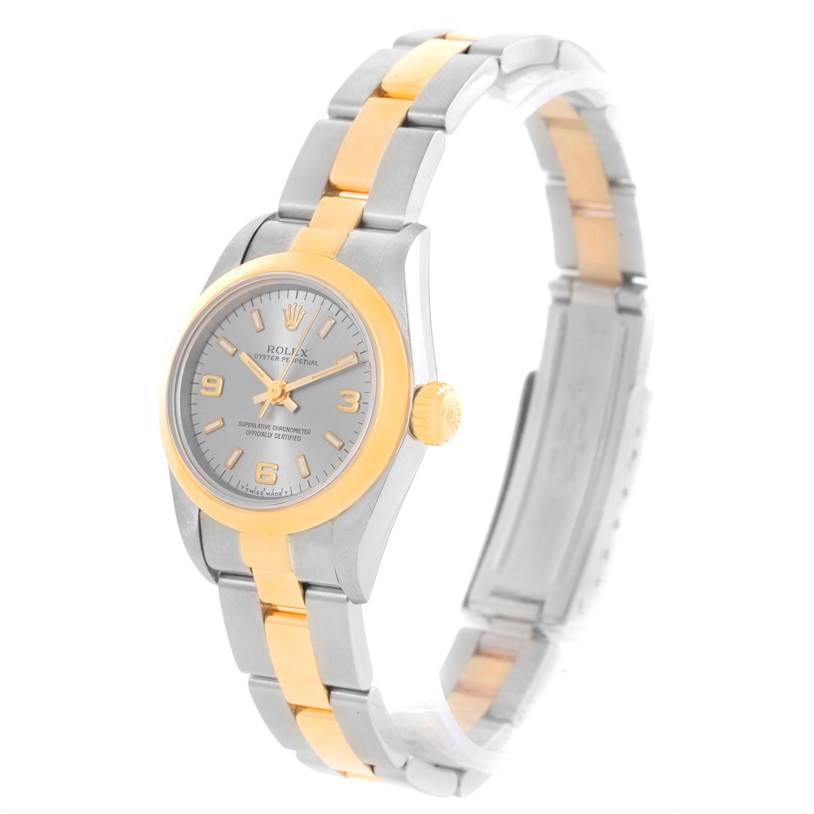 The Rolex Oyster Perpetual 67183 Women's Steel and Gold (two tone) Grey Dial 67183 Women's Steel and Gold (two tone) Grey Dial watch is shown at a slight angle, highlighting its face, bezel, crown, and bracelet.