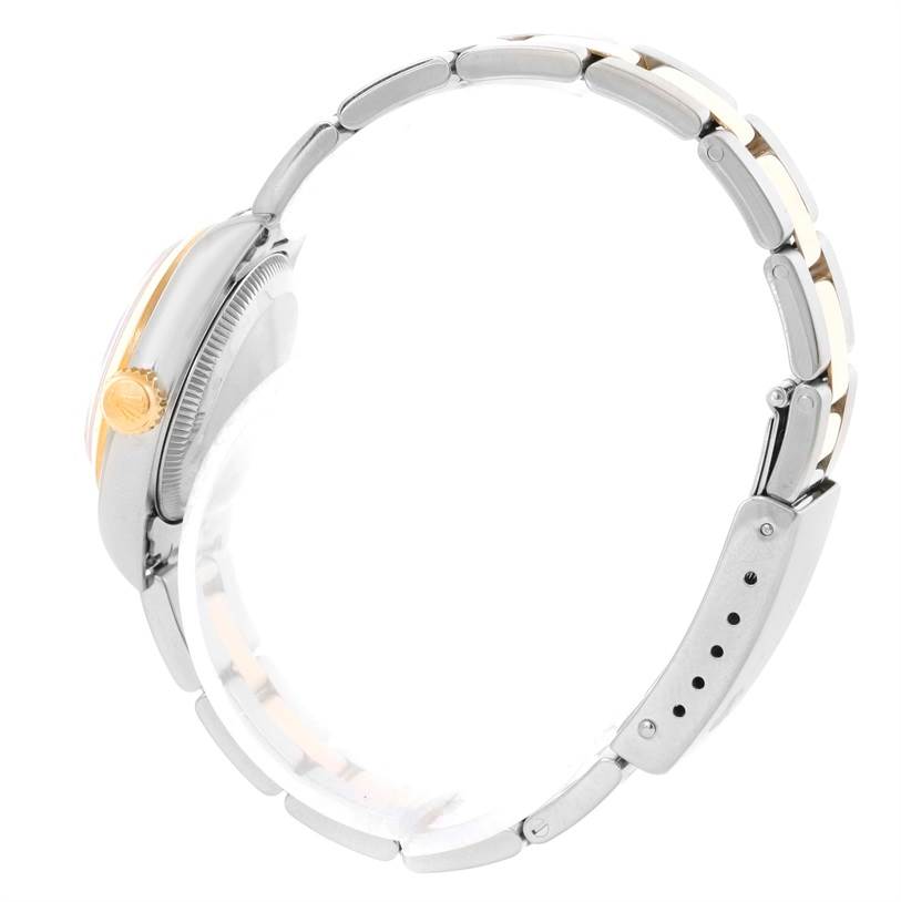 This image shows a side view of a Rolex Oyster Perpetual 67183 Women's Steel and Gold (two tone) Grey Dial 67183 Women's Steel and Gold (two tone) Grey Dial watch, highlighting its crown, case, and bracelet.