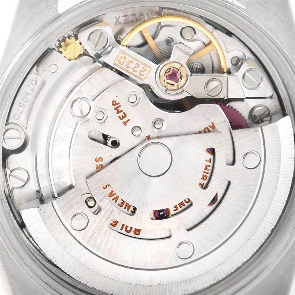 The image shows the movement and inner mechanism of a Rolex Oyster Perpetual 76183 Women's Steel and Gold (two tone) Grey Dial 76183 Women's Steel and Gold (two tone) Grey Dial watch, viewed from the back.