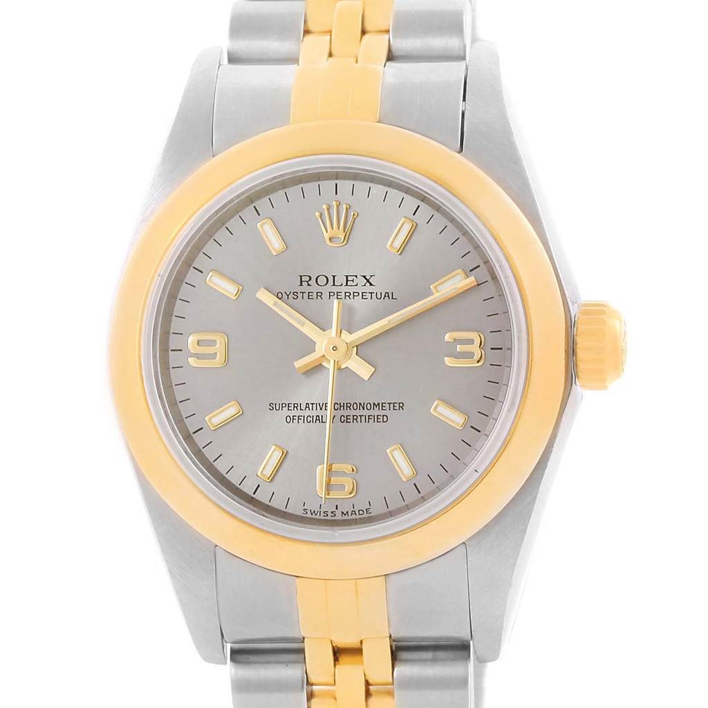 The image shows a front view of a Rolex Oyster Perpetual 76183 Women's Steel and Gold (two tone) Grey Dial 76183 Women's Steel and Gold (two tone) Grey Dial watch, highlighting the face, bezel, and part of the bracelet.