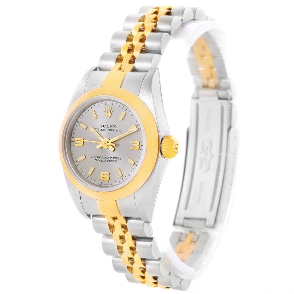 The image shows a Rolex Oyster Perpetual 76183 Women's Steel and Gold (two tone) Grey Dial 76183 Women's Steel and Gold (two tone) Grey Dial watch at an angle, highlighting its silver and gold bracelet, dial, and case.