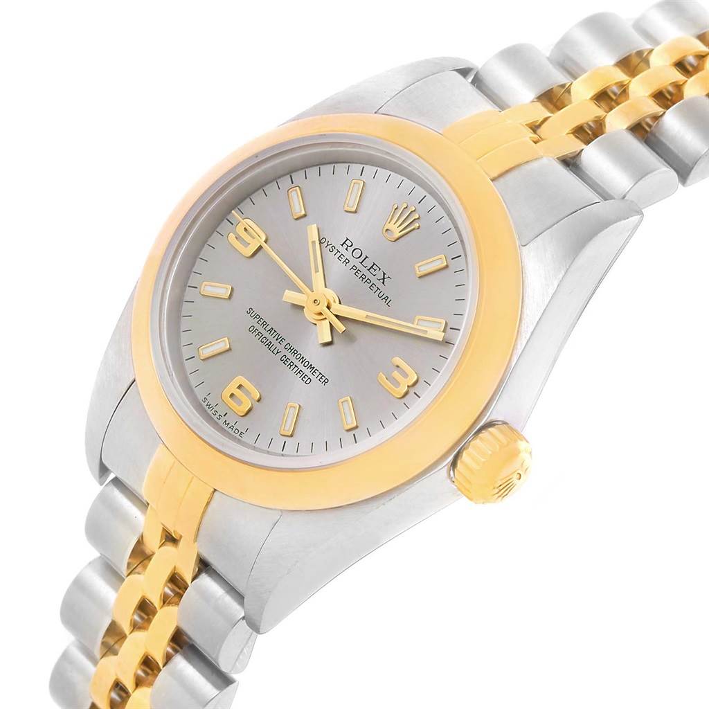 The image shows a Rolex Oyster Perpetual 76183 Women's Steel and Gold (two tone) Grey Dial 76183 Women's Steel and Gold (two tone) Grey Dial watch from a slightly angled top view, highlighting its dial, bezel, and bracelet.
