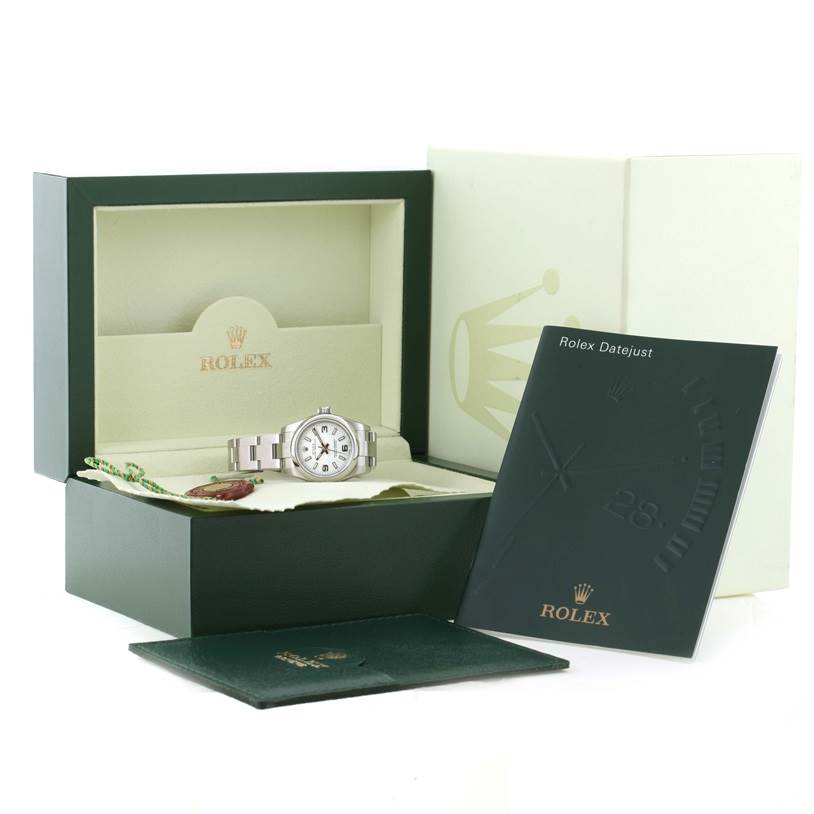 The Rolex Oyster Perpetual 176200 Women's Stainless Steel White Dial 176200 Women's Stainless Steel White Dial watch is shown in its box along with manuals and accessories.