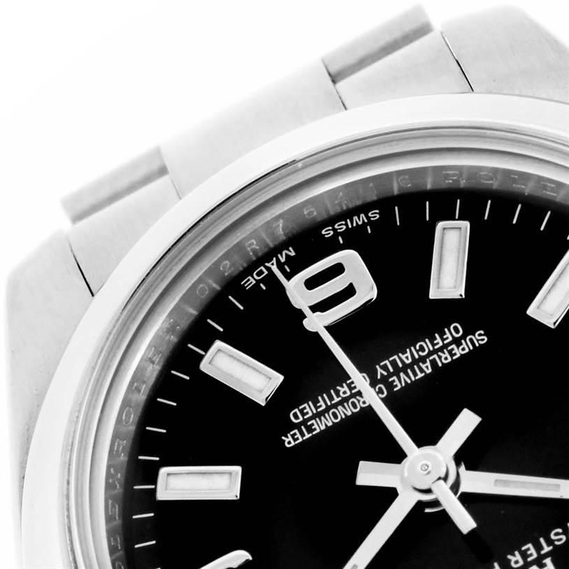 This image shows a close-up of the dial and part of the bracelet of a Rolex Oyster Perpetual 176200 Women's Stainless Steel Black Dial 176200 Women's Stainless Steel Black Dial watch.