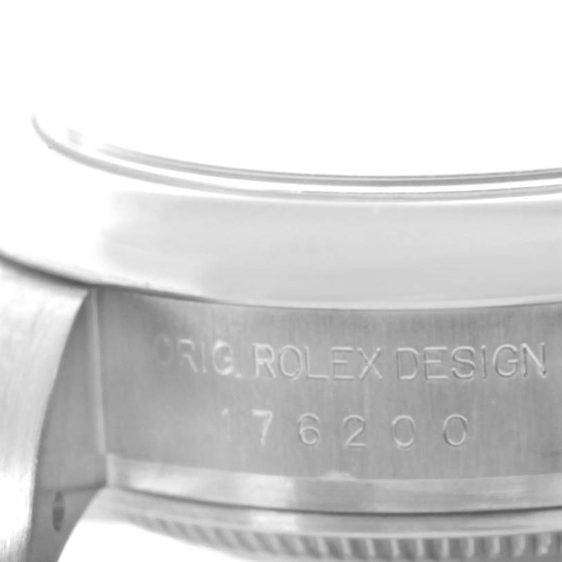 The image shows a side view of the case of a Rolex Oyster Perpetual 176200 Women's Stainless Steel Black Dial 176200 Women's Stainless Steel Black Dial watch, revealing design engraving and model number 176200.