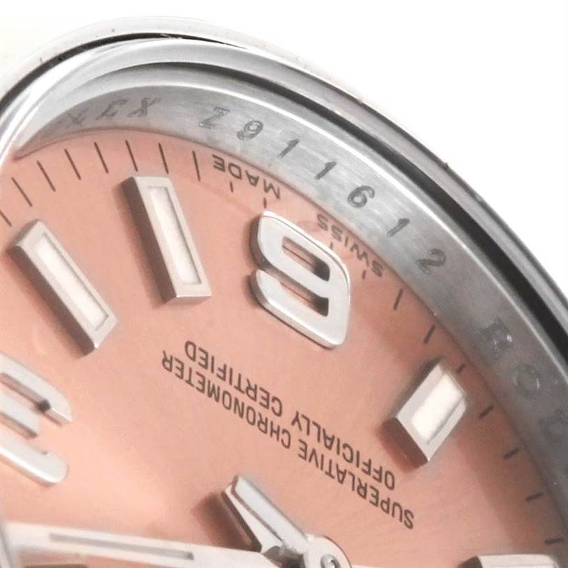 This image shows a close-up of the dial and bezel of a Rolex Oyster Perpetual 176200 Women's Stainless Steel Pink Dial 176200 Women's Stainless Steel Pink Dial watch.
