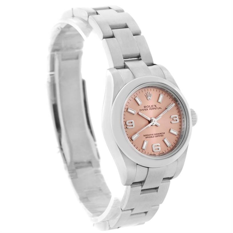 This image shows a Rolex Oyster Perpetual 176200 Women's Stainless Steel Pink Dial 176200 Women's Stainless Steel Pink Dial watch from an angled side view, highlighting the bracelet, case, and peach dial.