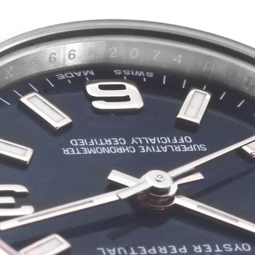 This image shows a close-up angle of the dial, hands, and indices of a Rolex Oyster Perpetual 176200 Women's Stainless Steel Blue Dial 176200 Women's Stainless Steel Blue Dial watch.