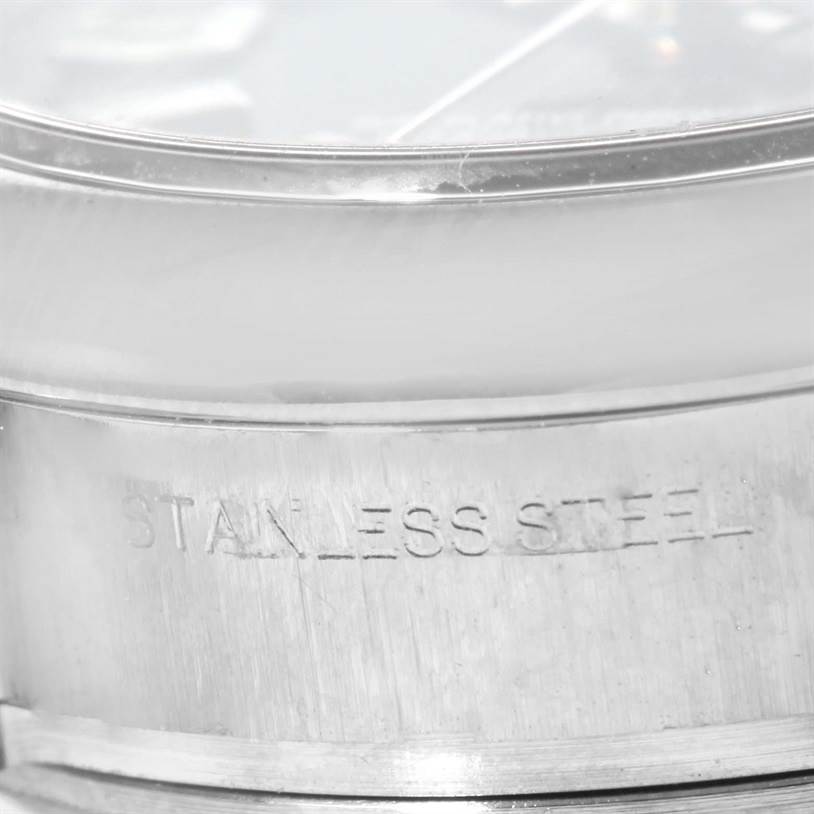 The image shows a close-up of the stainless steel casing of a Rolex Oyster Perpetual 176200 Women's Stainless Steel Blue Dial 176200 Women's Stainless Steel Blue Dial watch.