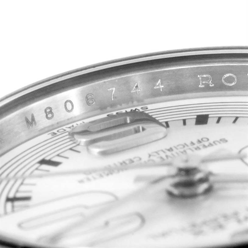 The image shows a close-up of a Rolex Oyster Perpetual 176234 Women
s Stainless Steel Silver Dial 176234 Women
s Stainless Steel Silver Dial watch
s dial and the inner part of the bezel, including the serial number.