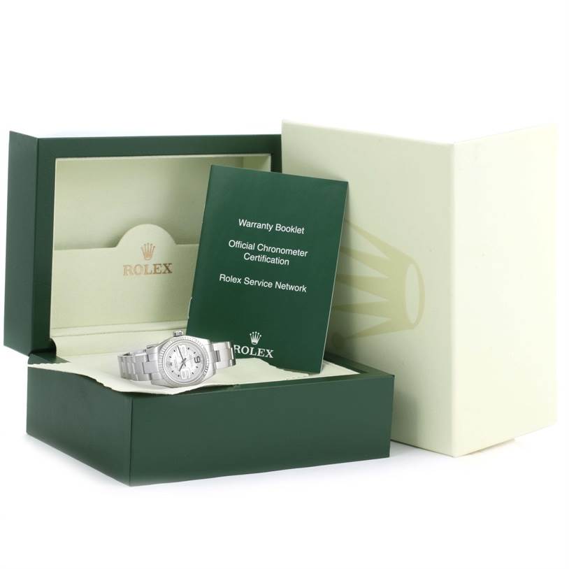 The image shows a Rolex Oyster Perpetual 176234 Women
s Stainless Steel Silver Dial 176234 Women
s Stainless Steel Silver Dial watch in its box alongside a warranty booklet and certification.