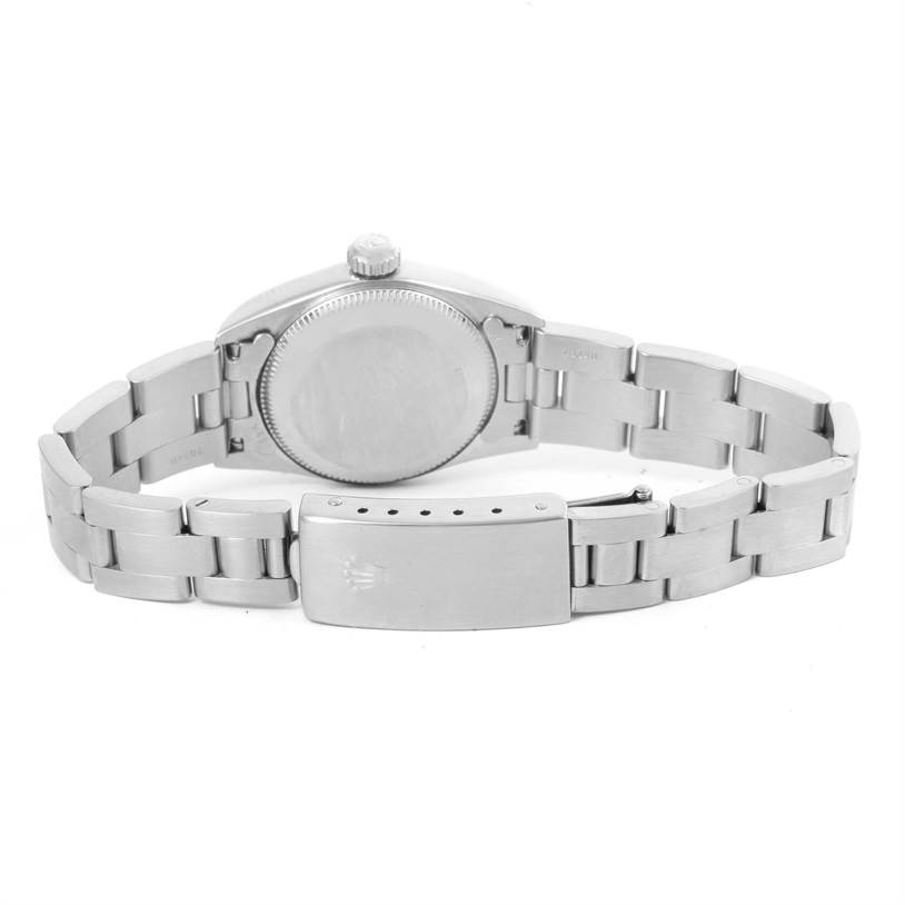 This image shows the back view of a Rolex Oyster Perpetual 67180 Women's Stainless Steel Pink Dial 67180 Women's Stainless Steel Pink Dial watch, focusing on the case back and bracelet with the clasp.