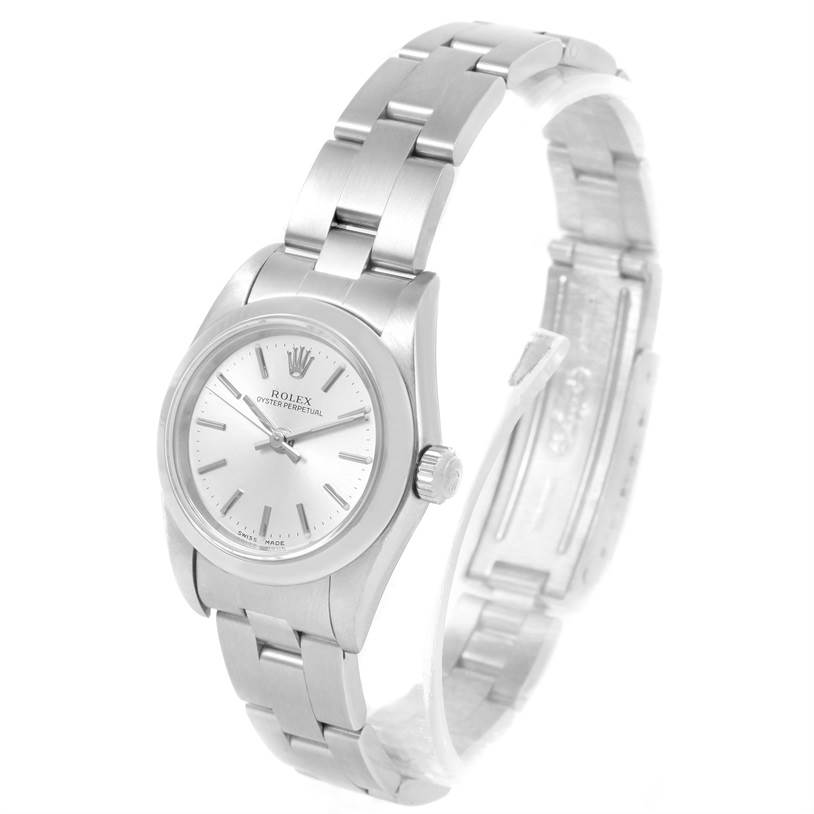 The image shows a Rolex Oyster Perpetual 76080 Women
s Stainless Steel Silver Dial 76080 Women
s Stainless Steel Silver Dial watch from an oblique angle, highlighting the dial, crown, and partially opened bracelet.