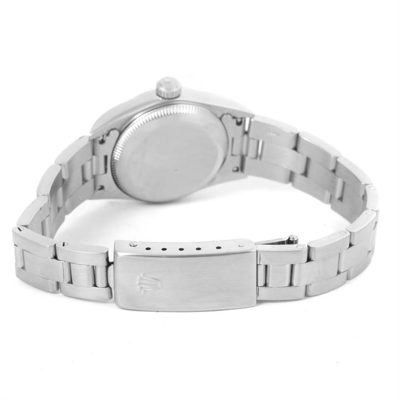 The image shows the backside of a Rolex Oyster Perpetual 76080 Women
s Stainless Steel Silver Dial 76080 Women
s Stainless Steel Silver Dial watch, focusing on the case back and the clasp of the band.