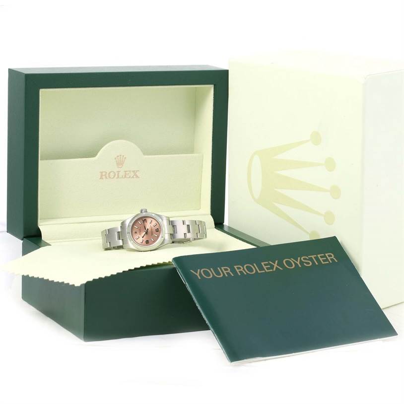 The image shows a Rolex Oyster Perpetual 176200 Women's Stainless Steel Pink Dial 176200 Women's Stainless Steel Pink Dial watch displayed in a green and cream box, with accompanying documentation on the side.