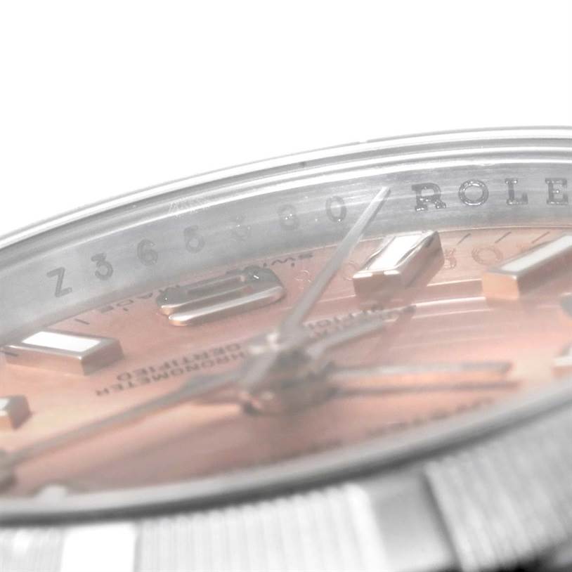 The close-up angle shows the dial, hands, and part of the bezel of a Rolex Oyster Perpetual 176200 Women's Stainless Steel Pink Dial 176200 Women's Stainless Steel Pink Dial watch.