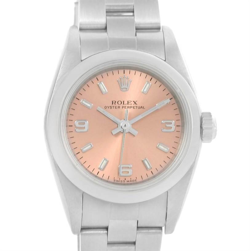 The Oyster Perpetual Rolex watch is shown from a front angle, displaying its dial, hands, bezel, and bracelet.