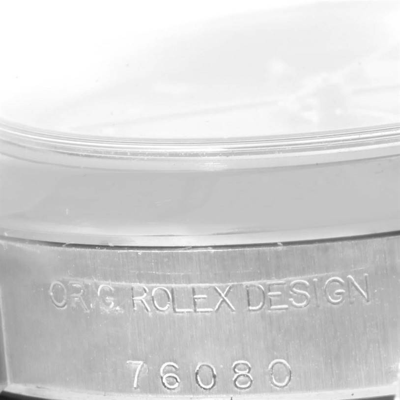 The image shows a close-up of the side engraving on the case of the Rolex Oyster Perpetual 76080 Women's Stainless Steel Pink Dial 76080 Women's Stainless Steel Pink Dial watch.