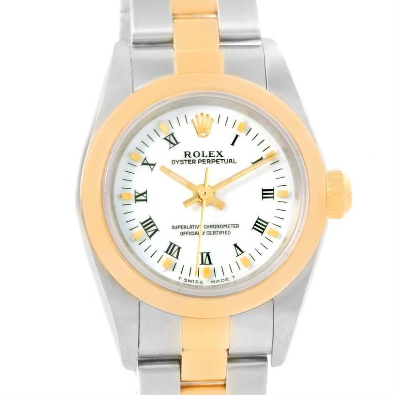 The image shows a front view of a Rolex Oyster Perpetual watch with a two-tone metal band and a white dial with Roman numerals.