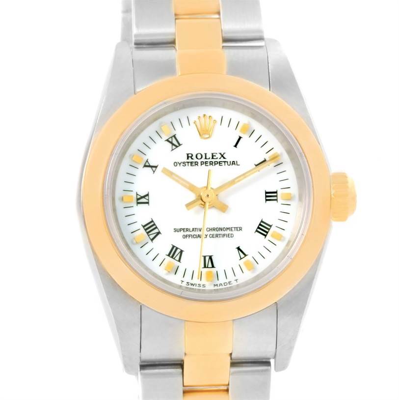 The image shows a front view of a Rolex Oyster Perpetual 76183 Women's Steel and Gold (two tone) White Dial 76183 Women's Steel and Gold (two tone) White Dial watch with a two-tone metal band and a white dial with Roman numerals.