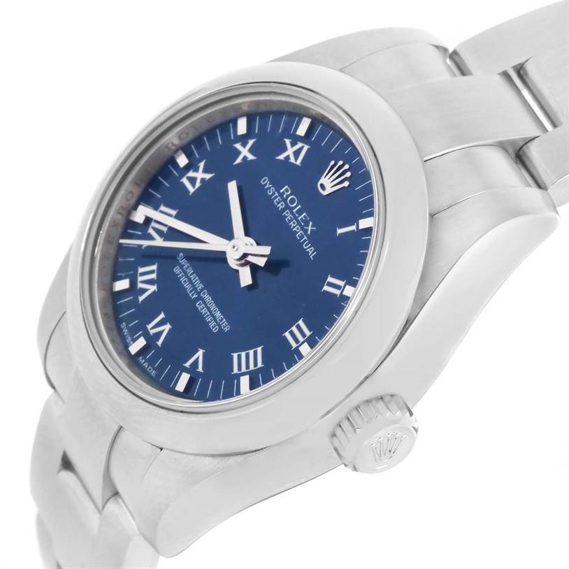 The image shows a side angle of the Rolex Oyster Perpetual 176200 Women's Stainless Steel Blue Dial 176200 Women's Stainless Steel Blue Dial watch, featuring its blue dial, Roman numeral markers, and fluted bezel.