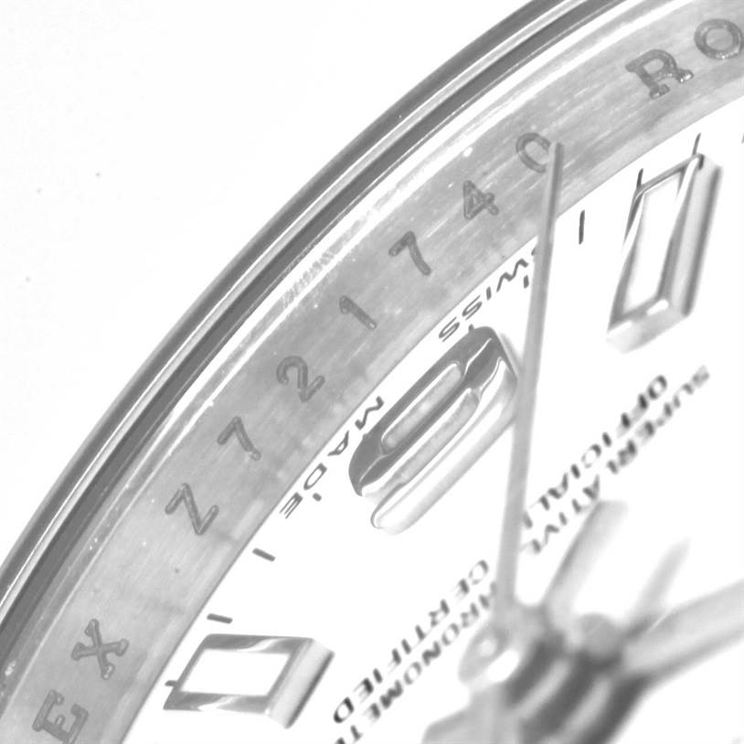 The image shows a close-up of the Rolex Oyster Perpetual 176210 Women
s Stainless Steel White Dial 176210 Women
s Stainless Steel White Dial
s dial, partial case, and bezel with the serial number.