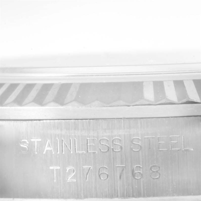 This image shows a close-up view of the side of the Rolex Oyster Perpetual 67194 Women's Stainless Steel Silver Dial 67194 Women's Stainless Steel Silver Dial watch case, highlighting the engraved text "STAINLESS STEEL T276768".