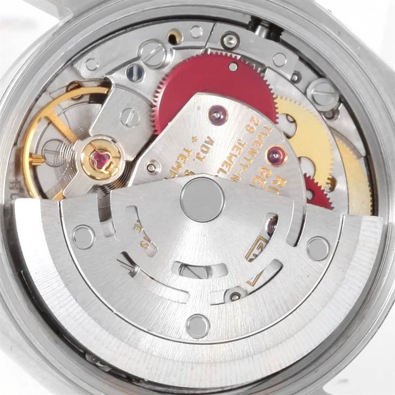 The image shows the intricate internal mechanism of a Rolex Oyster Perpetual 67194 Women's Stainless Steel Silver Dial 67194 Women's Stainless Steel Silver Dial watch from a close-up angle.