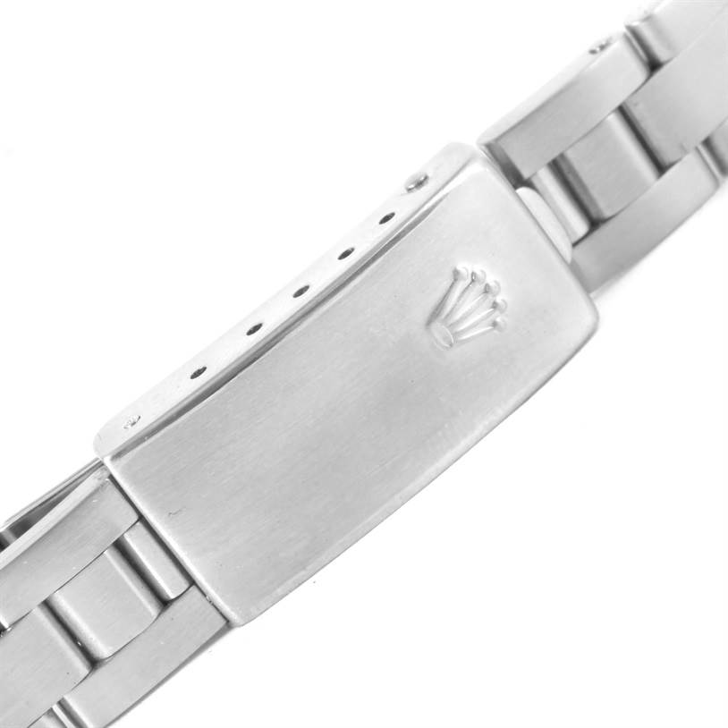 This image shows the clasp and part of the metal bracelet from a Rolex Oyster Perpetual 67194 Women's Stainless Steel Silver Dial 67194 Women's Stainless Steel Silver Dial watch.